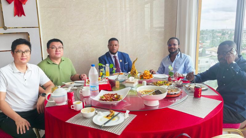 Tavol team dining with customers in Africa